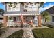 Charming two-story home with a welcoming front porch and landscaped front yard at 4106 N Central Ave, Tampa, FL 33603