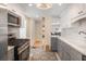 Bright kitchen with stainless appliances, stone countertops, tiled floor, and a wine rack at 4106 N Central Ave, Tampa, FL 33603