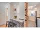 Stylish kitchen with a brick accent wall, wine rack, and tiled floors at 4106 N Central Ave, Tampa, FL 33603