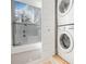 Laundry room with stacked washer and dryer and a window at 4106 N Central Ave, Tampa, FL 33603