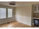 Spacious living area with hardwood floors, wainscoting, and a built-in bar with a wine cooler at 4106 N Central Ave, Tampa, FL 33603