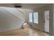 Bright living area with hardwood floors, stairs and lots of natural light from large windows at 4106 N Central Ave, Tampa, FL 33603