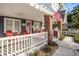 Inviting covered porch with brick pillars and a cozy seating area at 4106 N Central Ave, Tampa, FL 33603
