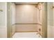 Modern shower with tile surround and brass fixtures at 4106 N Central Ave, Tampa, FL 33603