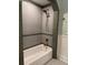 Well-lit tiled shower with updated fixtures at 4106 N Central Ave, Tampa, FL 33603
