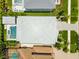 An overhead view reveals the home's new roof, pristine backyard oasis, and lush landscaping, ensuring curb appeal and privacy at 4109 W Inman Ave, Tampa, FL 33609