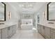 Luxurious bathroom with double vanities, soaking tub, and walk-in shower at 4109 W Inman Ave, Tampa, FL 33609