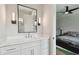 Bathroom with vanity, mirror, and doorway into bedroom at 4109 W Inman Ave, Tampa, FL 33609