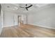 Bright, spacious bedroom with hardwood floors, coffered ceiling, and access to a walk-in closet at 4109 W Inman Ave, Tampa, FL 33609