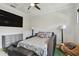 This bedroom features unique decor, a ceiling fan, and hardwood floors at 4109 W Inman Ave, Tampa, FL 33609