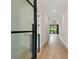 Elegant foyer featuring a glass door, hardwood flooring, and views of the living room at 4109 W Inman Ave, Tampa, FL 33609