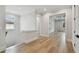 Bright hallway with wood floors and an open doorway to another room at 4109 W Inman Ave, Tampa, FL 33609