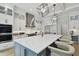 This modern kitchen features an oversized island, stainless steel appliances, and custom cabinetry at 4109 W Inman Ave, Tampa, FL 33609
