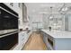 Modern kitchen with a large island, stainless appliances, and a sleek design at 4109 W Inman Ave, Tampa, FL 33609