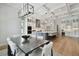 Open concept kitchen and dining area with a large island, modern appliances, and hardwood floors at 4109 W Inman Ave, Tampa, FL 33609