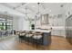 Spacious kitchen with a large island, stainless steel appliances, and modern pendant lighting at 4109 W Inman Ave, Tampa, FL 33609