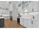 Well-lit kitchen features modern cabinets, stainless steel appliances, and hardwood floors at 4109 W Inman Ave, Tampa, FL 33609