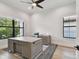 Bright office space with large windows, a ceiling fan, and an elegant desk at 4109 W Inman Ave, Tampa, FL 33609