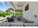Covered patio with outdoor kitchen, fire pit, and comfortable seating area, perfect for outdoor living at 4109 W Inman Ave, Tampa, FL 33609