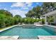 Inviting pool and spa with an outdoor kitchen create an oasis for relaxation and outdoor entertaining at 4109 W Inman Ave, Tampa, FL 33609