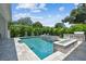 Beautiful backyard pool with outdoor kitchen and fire feature, perfect for entertaining guests at 4109 W Inman Ave, Tampa, FL 33609