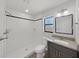 Bathroom featuring tiled shower, updated fixtures, and a granite countertop at 4652 Swallowtail Dr, New Port Richey, FL 34653