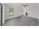 Bedroom with luxury vinyl flooring and easy access to the attached bathroom at 4652 Swallowtail Dr, New Port Richey, FL 34653
