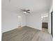 Bedroom with luxury vinyl flooring and easy access to the attached bathroom and closet at 4652 Swallowtail Dr, New Port Richey, FL 34653