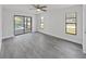Bedroom with sliding glass doors that open up to a screened lanai with a pool at 4652 Swallowtail Dr, New Port Richey, FL 34653
