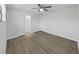 Inviting bedroom featuring light gray walls, a ceiling fan, vinyl flooring, and a closet at 4652 Swallowtail Dr, New Port Richey, FL 34653