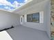 Entrance to property featuring painted door and window with white shutters at 4652 Swallowtail Dr, New Port Richey, FL 34653