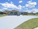 Charming single-story home featuring a stone facade, well-maintained landscaping, and a long driveway at 4652 Swallowtail Dr, New Port Richey, FL 34653