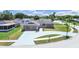 Beautiful single-story home with a stone facade, an extended driveway, and a manicured lawn at 4652 Swallowtail Dr, New Port Richey, FL 34653