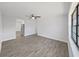 Bright living room with luxury vinyl flooring and a ceiling fan at 4652 Swallowtail Dr, New Port Richey, FL 34653