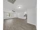 Bright living room featuring a ceiling fan, recessed lights, and hardwood floors at 4652 Swallowtail Dr, New Port Richey, FL 34653