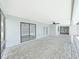 Large screened-in patio featuring neutral paint, ceiling fans, and access to yard at 4652 Swallowtail Dr, New Port Richey, FL 34653