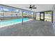 Screened-in patio showcases a refreshing pool and lounge area at 4652 Swallowtail Dr, New Port Richey, FL 34653