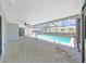 Screened-in patio features a refreshing pool and plenty of lounge area at 4652 Swallowtail Dr, New Port Richey, FL 34653