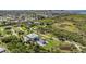 Breathtaking aerial view of the expansive estate, showcasing the home's prime location and private setting at 4710 Troydale Rd, Tampa, FL 33615