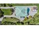 Aerial view of estate showcasing lush landscaping, pool, sundeck, and circular drive at 4710 Troydale Rd, Tampa, FL 33615
