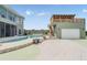 Backyard showcasing a private pool, spa, sundeck, outdoor kitchen, and cabana at 4710 Troydale Rd, Tampa, FL 33615