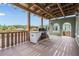 Spacious balcony offers picturesque views and a built-in grill, ideal for outdoor dining and relaxation at 4710 Troydale Rd, Tampa, FL 33615