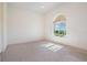 Cozy bedroom with plush carpeting, natural light, and ample closet space, creating a comfortable retreat at 4710 Troydale Rd, Tampa, FL 33615