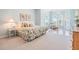 Bright bedroom featuring large windows, chandelier, and sitting area at 4710 Troydale Rd, Tampa, FL 33615