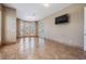 Bright bedroom featuring neutral walls, tile floors, large windows, and access to outdoor patio at 4710 Troydale Rd, Tampa, FL 33615