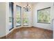 Bright breakfast nook with large windows, offering serene outdoor views at 4710 Troydale Rd, Tampa, FL 33615