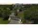 Estate home with lush landscaping, gated entrance, and circular drive offers luxurious curb appeal at 4710 Troydale Rd, Tampa, FL 33615