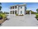 Stunning two-story home features a grand driveway, arched entryways and balcony, creating an elegant and inviting facade at 4710 Troydale Rd, Tampa, FL 33615