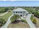 Stunning home boasts lush landscaping, a circular driveway, and an elegant entrance, creating impressive curb appeal at 4710 Troydale Rd, Tampa, FL 33615