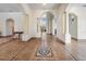 Elegant foyer showcasing tile flooring with decorative inlays, columns and arched doorways and architectural details at 4710 Troydale Rd, Tampa, FL 33615